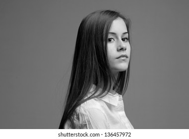 Portrait Of Beautiful Young Teen With Serious Expression.