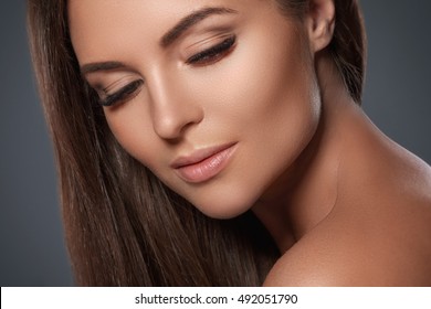 Portrait of beautiful and young woman with a artificial eyelashes