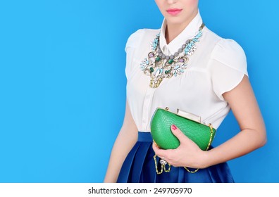 Portrait of beautiful young woman with bag.Fashion photo