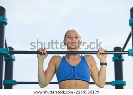 Similar – Image, Stock Photo Muscular man doing chin-ups