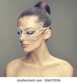 Portrait Of A Beautiful Young Woman In Carnival Mask