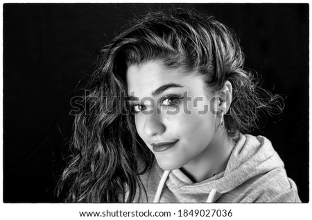 Similar – Woman at the window of a parking garage