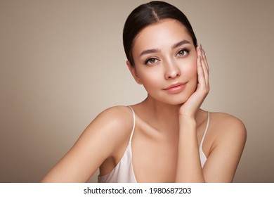 Portrait beautiful young woman with clean fresh skin. Model with healthy skin, close up portrait. Cosmetology, beauty and spa - Shutterstock ID 1980687203