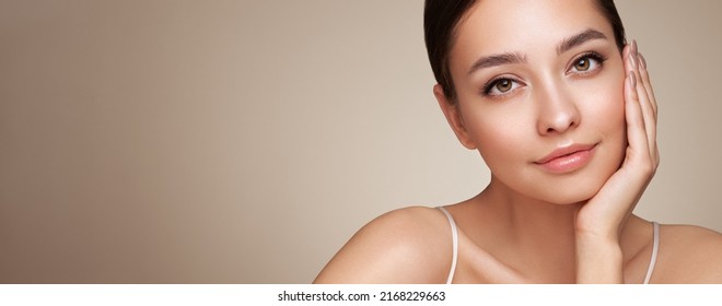 Portrait beautiful young woman with clean fresh skin. Model with healthy skin, close up portrait. Cosmetology, beauty and spa - Shutterstock ID 2168229663