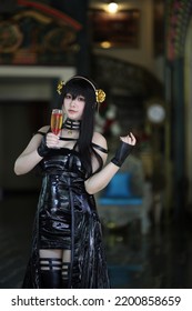 Portrait Of A Beautiful Young Woman Cosplay With Spy Dress