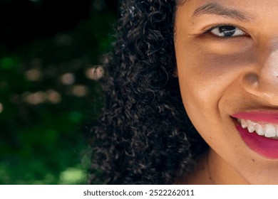 Portrait of a beautiful young woman with curly hair, close up - Powered by Shutterstock