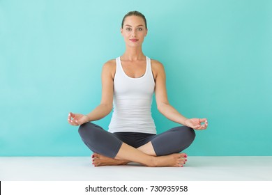 Portrait Of Beautiful Young Woman Doing Yoga At Home.