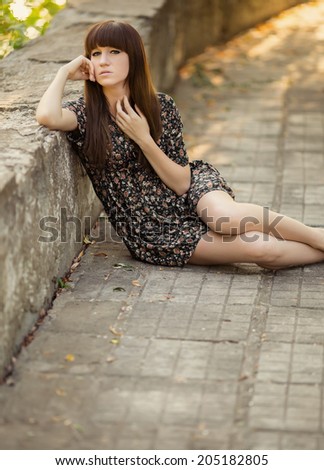 Similar – Portrait of a girl in red dress on a wooden door