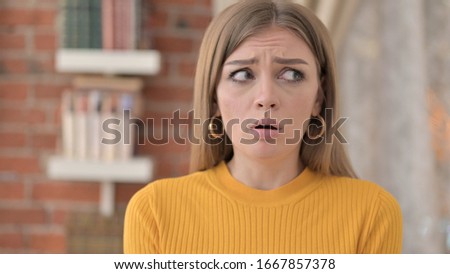 Portrait of Beautiful Young Woman Feeling Scared