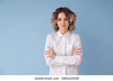 Portrait Of Beautiful Young Woman In Formal Clothes On Color Background