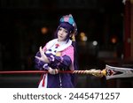 Portrait of a beautiful young woman game Cosplay with Chinese dress