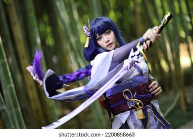 Portrait of a beautiful young woman game cosplay with samurai dress costume on Japanese garden - Shutterstock ID 2200858663