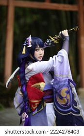 Portrait of a beautiful young woman game cosplay with samurai dress costume on Japanese garden - Shutterstock ID 2224276403