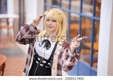 Portrait of a beautiful young woman game Cosplay with blonde hair