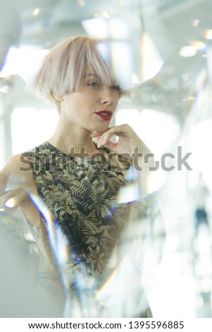 portrait of a beautiful young woman in the mirror, reflection,