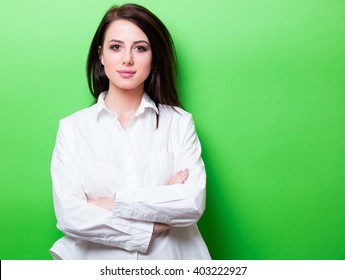 Portrait Of The Beautiful Young Woman On The Green Background