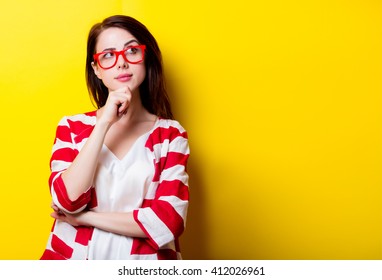 portrait of the beautiful young woman on the yellow background - Shutterstock ID 412026961