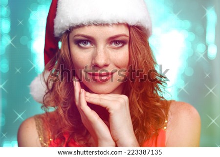 Portrait of beautiful young woman on bright blue background