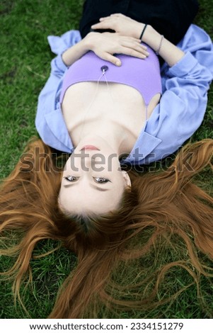 Similar – Image, Stock Photo Young redhead woman reading a red book