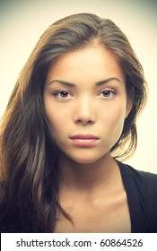 Portrait Of Beautiful Young Woman With Serious Look. Mixed Race Asian Chinese / White Caucasian Female Model.