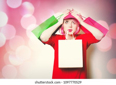 portrait of beautiful young woman with shopping bags - Powered by Shutterstock