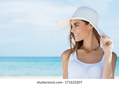 Portrait Of A Beautiful Young Woman With Sunhat At Beach - Powered by Shutterstock