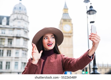 Portrait Of Beautiful Young Woman Taking Selfie With A Smartphone On The London