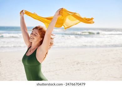 Portrait of beautiful young woman walking with yellow scarf at tropical beach with copy space. Happy healthy girl with red hair having fun during summer vacation at sea, freedom and wellness concept. - Powered by Shutterstock