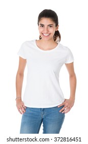 Portrait Of Beautiful Young Woman Wearing Blank Tshirt On White Background