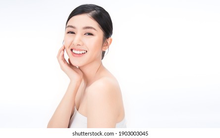 Portrait Of Beauty Asian Woman With Fair Perfect Healthy Glow Skin Hand Touching Chin On White Background, Young Beautiful Asia Girl With Pretty Smile Face Care. Beauty Korean Spa Skincare.