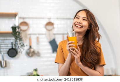 Portrait of beauty healthy asian woman making orange fruit smoothie with blender.girl preparing cooking detox cleanse with fresh orange juice in kitchen at home.health, vitamin c, diet, healthy drink - Powered by Shutterstock