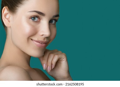 Portrait of beauty model with make-up, formed eyebrows  and long eyelashes. Beautiful young smiling women face with perfect fresh skin. Spa, skincare and wellness. Selective focus. Close-up.