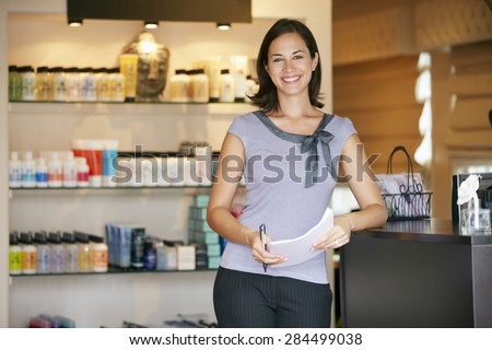 Similar – Image, Stock Photo A woman, owner of her own physiotherapy clinic, smiles confidently, on a plain blue background