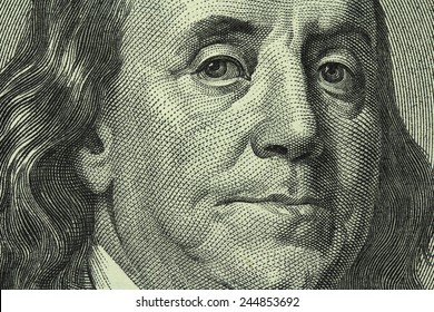 portrait of Benjamin Franklin on the hundred dollar bill closeup