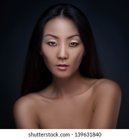 Portrait Of Beutiful Asian Woman Isolated On Dark Background