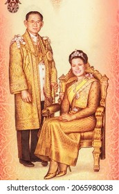 The portrait of H.M. King Bhumibol Adulyadej and the portrait of H.M. Queen Sirikit The Queen Mother in Thai Sivalai with tiara. Portrait from - Banknotes. 