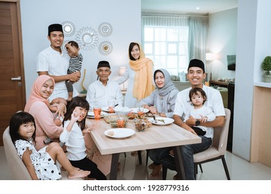 Portrait Of Big Asian Muslim Family On Iftar Dinner Together Smiling And Looking At Camera