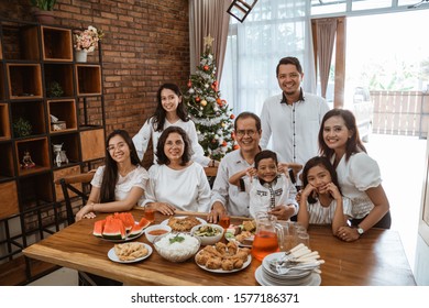 Portrait Of Big Family And Food For Lunch On Christmas Day Together