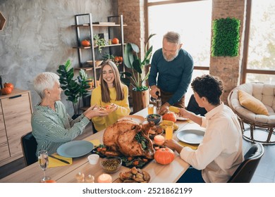 Portrait of big full family pass plate pour champagne thanksgiving gathering celebration dinner flat indoors - Powered by Shutterstock