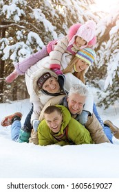 Portrait Of Big Happy Family Having Fun In Winter Park Covered With Snow