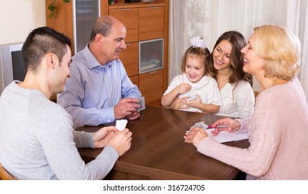 Portrait Of Big Multigenerational Family Playing Cards