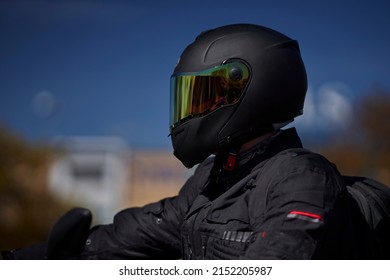 portrait of a biker in black helmet