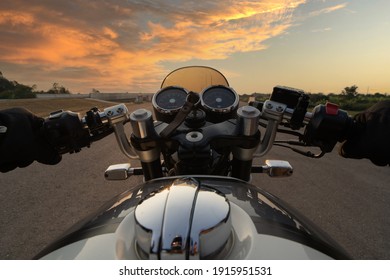 Portrait Of Biker And Motorcyclist On The Highway