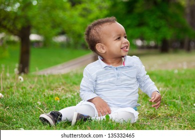 Portrait Of A Black African American Baby Boy Playing  In The Park - African Children