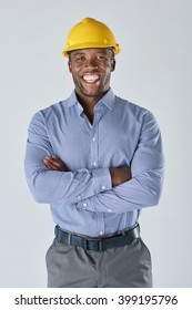 Portrait Of Black African Architect Engineer Surveyor With Construction Hardhat Isolated In Studio