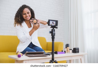 Portrait Of Black Blogger Woman Review Giveaway Make Up Gift To Fan Following Channel While Recording Video Makeup Cosmetic At Home Online Influencer Vlogger Girl Social Media Live Steaming Concept