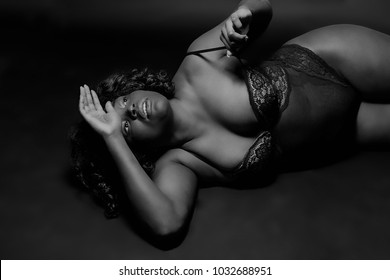 Portrait of a black curvy super model in lingerie. Black/white