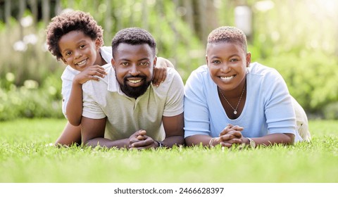 Portrait, black family and parents with kid, grass in backyard and outdoor weekend fun together. Happiness, love and sun, mother and father with children relax and smile in summer garden or lawn - Powered by Shutterstock