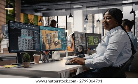 Portrait of black interior designer using high tech software for modern layout, 3D modeling program to design construction floor plan, Architectural blueprints on dual monitors, virtual assets.