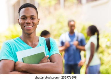 Portrait Of Black Male College Student Holding Books